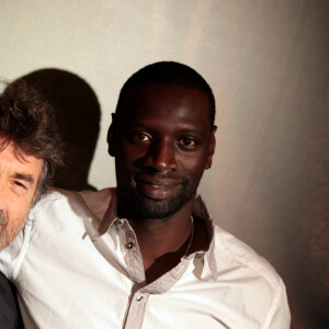 Omar Sy et François Cluzet à l'avant-première du film "Intouchables" au Gaumont Marignan, à Paris, le 18 octobre 2011.
© Agence / Bestimage