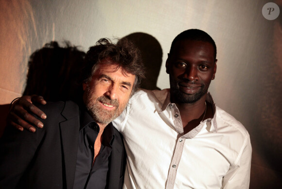Omar Sy et François Cluzet à l'avant-première du film "Intouchables" au Gaumont Marignan, à Paris, le 18 octobre 2011.
© Agence / Bestimage