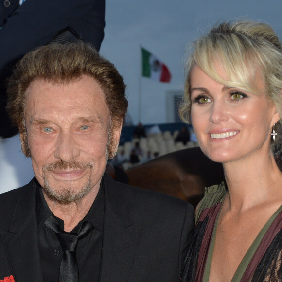 Johnny Hallyday et sa femme Laeticia Hallyday - Remise du Prix Eiffel avec Johnny et Laeticia Hallyday - Record du saut en hauteur de la ville de Paris / EOS - Longines Paris Eiffel Jumping à la plaine de Jeux de Bagatelle à Paris le 1er juillet 2016. Cette remise de prix est le prologue de la soirée au profit de l'association "La bonne étoile" de Laeticia Hallyday. © Olivier Borde / Veeren / Bestimage
