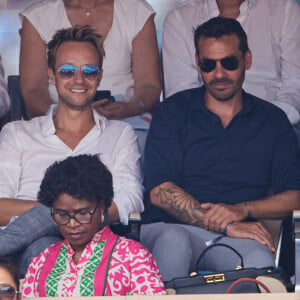 Cyril Féraud et un ami - Célébrités en tribunes des Internationaux de France de tennis de Roland Garros 2023 à Paris le 11 juin 2023. © Jacovides-Moreau/Bestimage