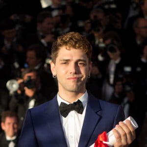 "Je n'ai plus l'envie ni la force de m'engager dans un projet pendant deux ans pour que personne ou presque ne le voie", a ajouté Xavier Dolan
Xavier Dolan, Prix du Jury pour "Mommy" - Photocall de la remise des palmes du 67 ème Festival du film de Cannes – Cannes le 24 mai 2014. 