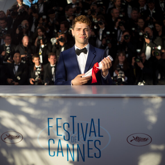 "Je n'ai plus l'envie ni la force de m'engager dans un projet pendant deux ans pour que personne ou presque ne le voie", a ajouté Xavier Dolan
Xavier Dolan, Prix du Jury pour "Mommy" - Photocall de la remise des palmes du 67 ème Festival du film de Cannes – Cannes le 24 mai 2014. 