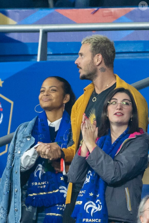 M. Pokora (Matt Pokora), sa femme Christina Milian assistent au match de la 5ème et avant-dernière journée de Ligue des nations entre la France et l'Autriche (2-0) au Stade de France à Saint-Denis le 22 septembre 2022.