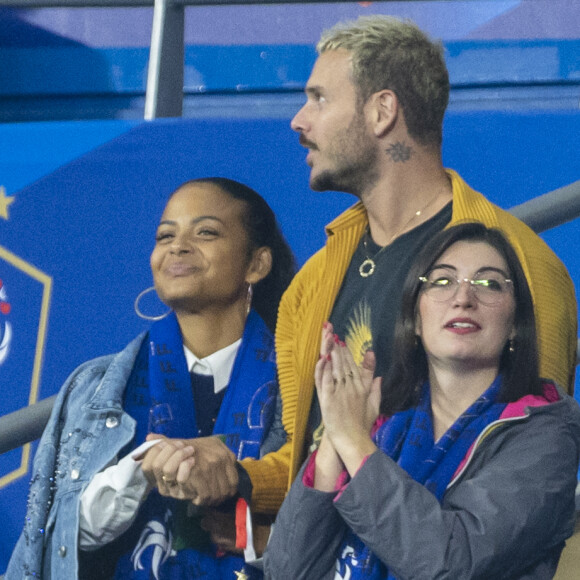 M. Pokora (Matt Pokora), sa femme Christina Milian assistent au match de la 5ème et avant-dernière journée de Ligue des nations entre la France et l'Autriche (2-0) au Stade de France à Saint-Denis le 22 septembre 2022.