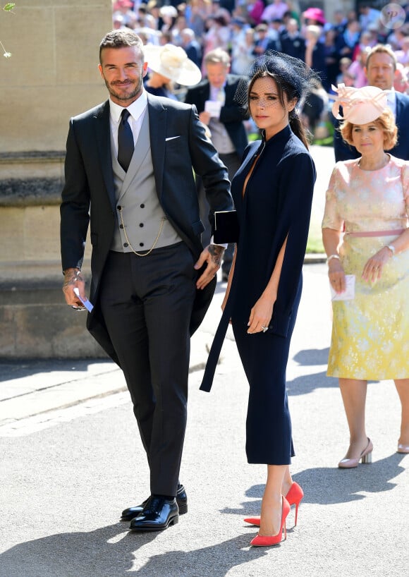 Malheureusement, il semblerait que ces quatre-là ne soient pas prêts à passer le réveillon ensemble.
David Beckham et sa femme Victoria arrivent à la chapelle St. George pour le mariage du prince Harry et de Meghan Markle au château de Windsor, Royaume Uni, le 19 mai 2018.