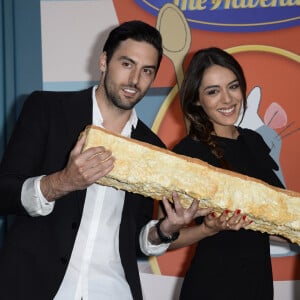 Andrien Galo et sa compagne Sofia Essaidi lors de la présentation en avant-première de la nouvelle attraction "Ratatouille : L'aventure totalement toquée" à Disneyland Paris à Marne-la-Vallée, le 21 juin 2014.