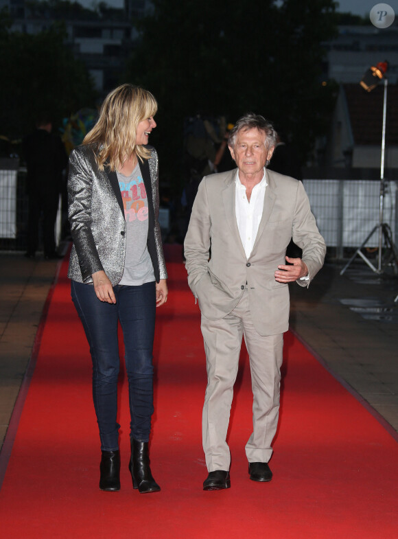 Roman Polanski et Emmanuelle Seigner arrivent à la première du film "Blue Jasmine" à Paris le 27 août 2013. © Denis Guignebourg / Bestimage 