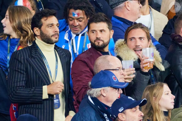 Maxim Nucci (Yodelice), Christophe Beaugrand et son mari Ghislain Gerin - People des les tribunes de la coupe du Monde de Rugby France 2023 - Match de quart de finale "France-Afrique du Sud (28-29)" au Stade de France à Saint-Denis 15 octobre 2023. © Moreau-Jacovides/Bestimage