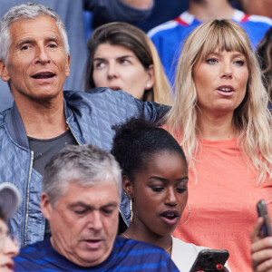 Nagui et sa femme Melanie Page - Célébrités dans les tribunes du match de football entre la France et la Grèce au Stade de France dans le cadre des éliminatoires pour l'Euro 2024, le 19 juin 2023. © Cyril Moreau/Bestimage