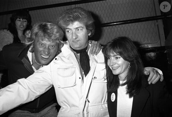 Archives - Johnny Hallyday, Eddy Mitchell et sa femme Muriel - Anniversaire de la creation du Golf Drouot. Beaucoup de debutants sont venus faire acte de presence pour remercier les fondateurs. Le 14 novembre 1980