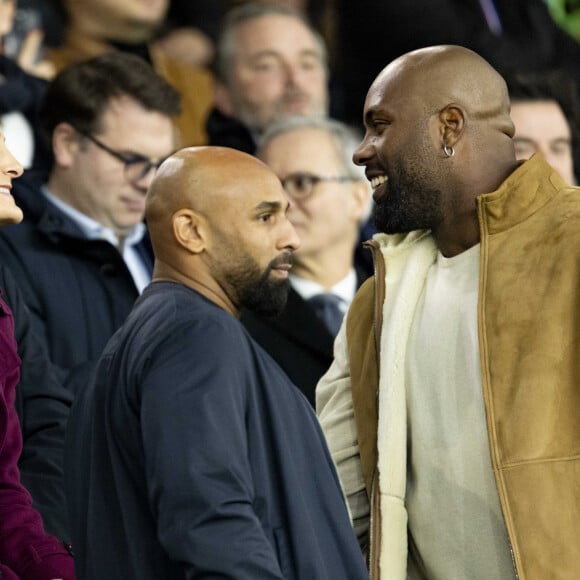 Amélie Oudéa Castéra (ministre des Sports et des Jeux Olympiques et Paralympiques), Teddy Riner - Célébrités dans les tribunes du match aller des huitièmes de finale de la Ligue des champions entre le PSG et la Real Sociedad (2-0) au Parc des Princes à Paris le 14 février 2024. © Cyril Moreau/Bestimage