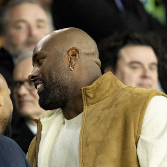 Amélie Oudéa Castéra (ministre des Sports et des Jeux Olympiques et Paralympiques), Teddy Riner - Célébrités dans les tribunes du match aller des huitièmes de finale de la Ligue des champions entre le PSG et la Real Sociedad (2-0) au Parc des Princes à Paris le 14 février 2024. © Cyril Moreau/Bestimage