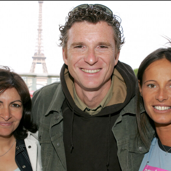 Avant de faire du journalisme, il pensait être prof de sport, sa passion.Denis Brogniart avec Anne Hidalgo (1ere Adjoint au Maire), et Nathalie Marquez-Pernaut pour Odyssea, (association de lutte contre le cancer du sein) lors de l'épreuve de course a pied sur 5 Kms au Champs de mars le 13 juin 2004. Photo by Laurent Zabulon/ABACA