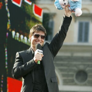 US actor Tom Cruise presents a teddy-bear he receives for his new born daughter Suri during his guest appearance on MTV Show TRL to present his new movie 'Mission Impossible III' on a stage build in square Piazza del Popolo in Rome, Italy, on April 24, 2006. Photo by Alessia Paradisi/ABACAPRESS.COM 