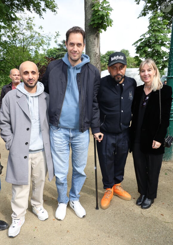 Mehdi Idir, Grand Corps Malade, Jean-Rachid et Katia Aznavour - Inauguration du Jardin "Charles Aznavour", Avenue des Champs-Elysées à Paris à l'occasion du Centième anniversaire de sa naissance, le 22 mai 2024. © Coadic Guirec/Bestimage 