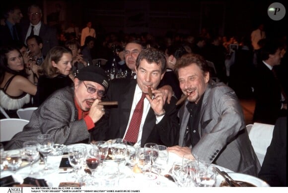 Ils se connaissaient depuis leur jeunesse. 
Ticky Holgado, Martin Lamotte et Johnny Hallyday - Soirée amateurs de cigares