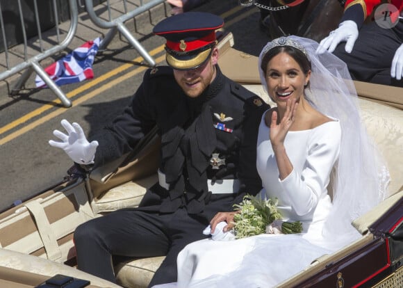 Le prince Harry, duc de Sussex, et Meghan Markle, duchesse de Sussex, en calèche au château de Windsor après la cérémonie de leur mariage au château de Windsor, Royaume Uni, le 19 mai 2018. 