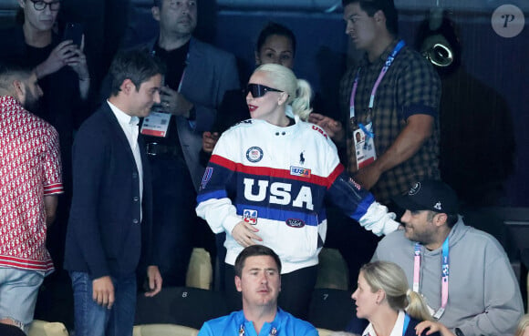 C'est ce qu'a appris en avant-première le Premier ministre démissionnaire !
Gabriel Attal et Lady Gaga, Michael Polansky - Lady Gaga et son fiancé Michael Polansky assistent à la victoire de Léon Marchand sur 400 m 4 nage lors des Jeux Olympiques de Paris 2024 (JO) à Paris La Defense Arena à Nanterre le 28 juillet 2024. © Dominique Jacovides-Pierre Perusseau/Bestimage 