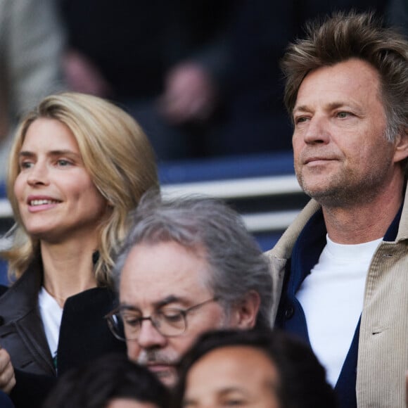 Alice Taglioni et son compagnon Laurent Delahousse dans les tribunes de la demi-finale retour de Ligue des champions entre le PSG face au Borussia Dortmund (0-1) au Parc des Princes à Paris le 7 mai 2024. © Cyril Moreau/Bestimage