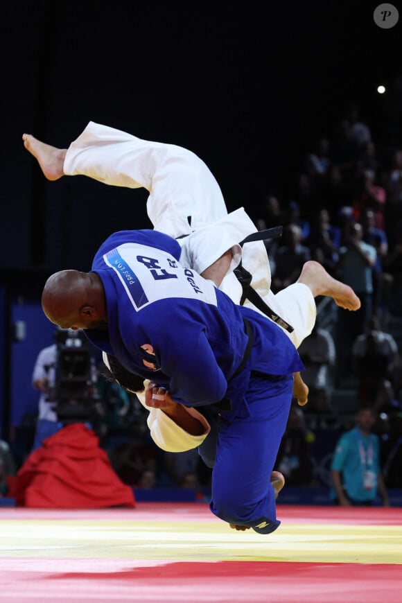 TEDDY RINER of France (blue) defeats TEMUR RAKHIMOV of Tajikistan (white) in the semifinal in the Judo Men's +100 kg on day 7 at the Paris 2024 Olympic Games in Champ de Mars Arena in Paris, France. © Mickael Chavet/ZUMA Press/Bestimage 