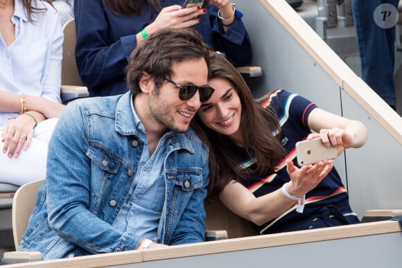 Vianney Bureau (Vianney) et sa compagne Catherine Robert dans les tribunes lors de la finale messieurs des internationaux de France de tennis de Roland Garros 2019 à Paris le 9 juin 2019.