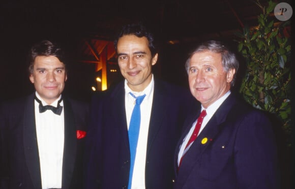 C'est en toute discrétion qu'il luttait contre la maladie.
Archives - Bernard Tapie, Didier Roustan et Michel Hidalgo - Soirée de privatisation de la chaîne TF1 à Paris. Le 15 avril 1987