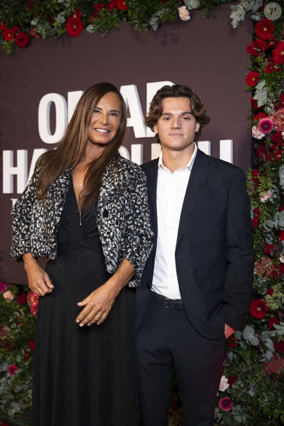 Nathalie Marquay-Pernaut et son fils Tom au photocall de la soirée Omar Harfouch "Dîner chez Maxim's" à Paris le 9 octobre 2024. © Perusseau / Tribeca / Bestimage