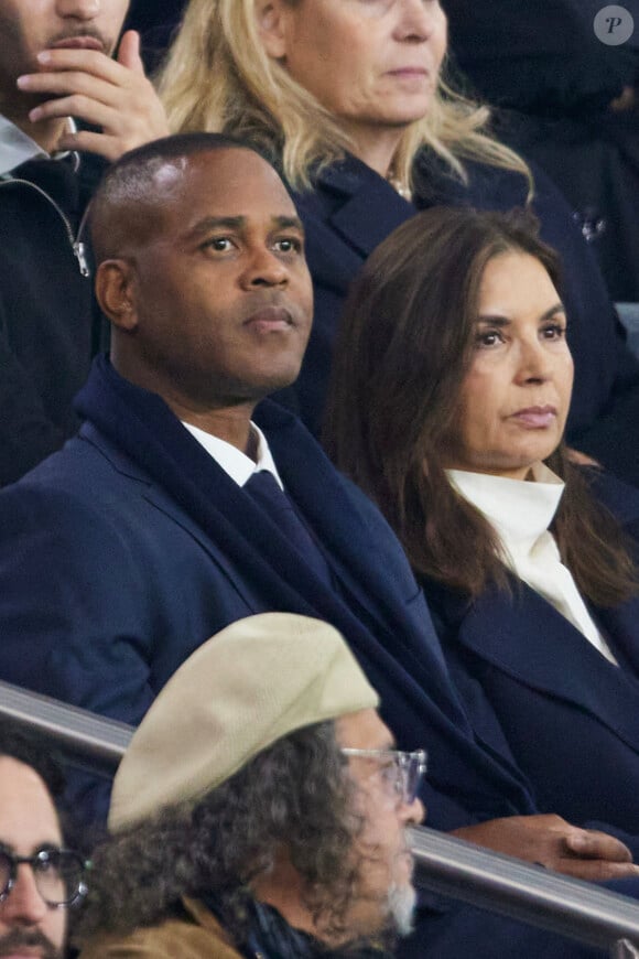 Patrick Kluivert et sa femme Rossana Kluivert dans les tribunes lors du match de Ligue Des Champions (LDC) "PSG - PSV Eindhoven (1-1)" au Parc des Princes à Paris, le 22 octobre 2024.