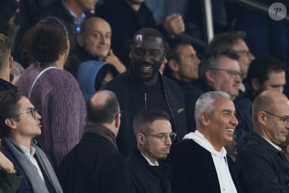 Ladji Doucouré dans les tribunes lors du match de Ligue Des Champions (LDC) "PSG - PSV Eindhoven (1-1)" au Parc des Princes à Paris, le 22 octobre 2024.