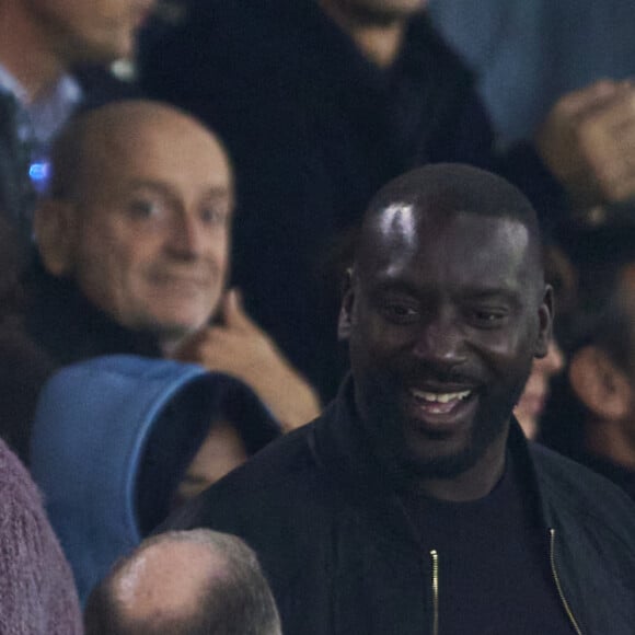 Ladji Doucouré dans les tribunes lors du match de Ligue Des Champions (LDC) "PSG - PSV Eindhoven (1-1)" au Parc des Princes à Paris, le 22 octobre 2024.