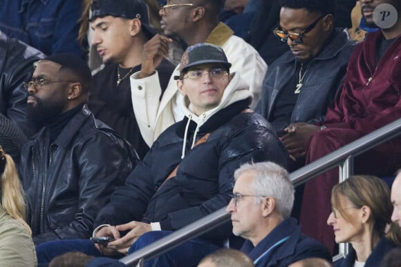 Raphaël Quenard dans les tribunes lors du match de Ligue Des Champions (LDC) "PSG - PSV Eindhoven (1-1)" au Parc des Princes à Paris, le 22 octobre 2024.