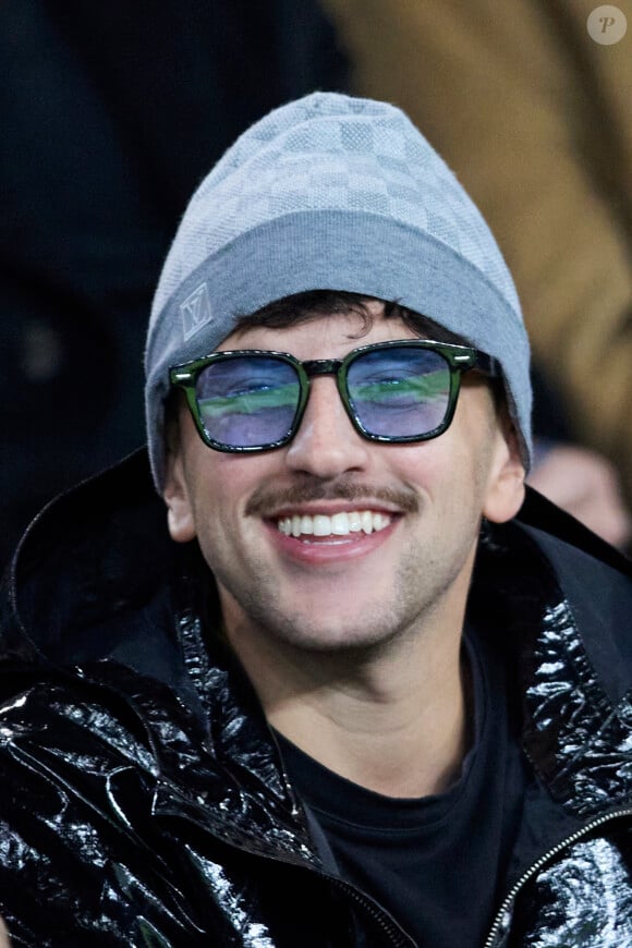 Just Riadh dans les tribunes lors du match de Ligue Des Champions (LDC) "PSG - PSV Eindhoven (1-1)" au Parc des Princes à Paris, le 22 octobre 2024.