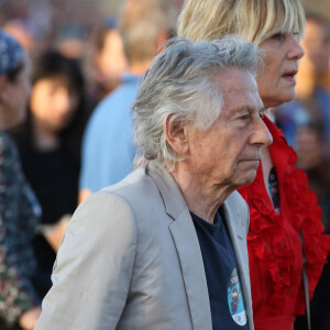 Roman Polanski et sa femme Emmanuelle Seigner - Les Rolling Stones en concert à l'hippodrome de Longchamp, dans le cadre de leur tournée anniversaire "Sixty", qui marque leurs 60 ans de carrière (1962-2022). Paris, le 23 juillet 2022. © Stéphane Vansteenkiste/Bestimage