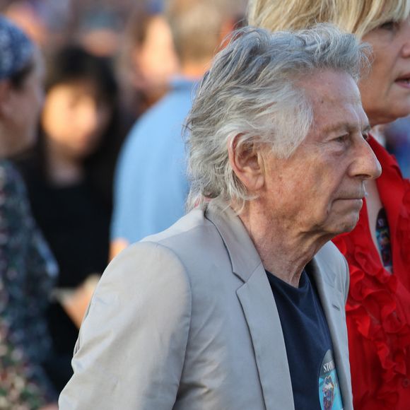 Roman Polanski et sa femme Emmanuelle Seigner - Les Rolling Stones en concert à l'hippodrome de Longchamp, dans le cadre de leur tournée anniversaire "Sixty", qui marque leurs 60 ans de carrière (1962-2022). Paris, le 23 juillet 2022. © Stéphane Vansteenkiste/Bestimage