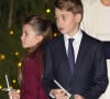 Très populaires à l'école de par leur statut, George, Charlotte et Louis doivent néanmoins garder les pieds sur terre. 
La princesse Charlotte de Galles et le prince George de Galles - Traditionnel concert de Noël "Together At Christmas" à l'abbaye de Westminster à Londres le 8 décembre 2023. 