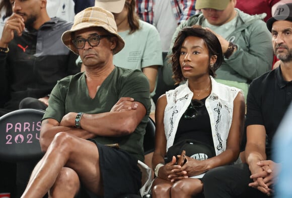 Yannick Noah et Malika était dans une maternité située dans le 15e arrondissement de Paris
 
Yannick Noah et sa compagne Malika - Les célébrités en tribunes pendant l'épreuve de basketball de Demi-Finale opposant la France à l'Allemagne lors des Jeux Olympiques de Paris 2024 (JO) à l'Arena Bercy, à Paris, France, le 8 août 2024. © Jacovides-Perusseau/Bestimage