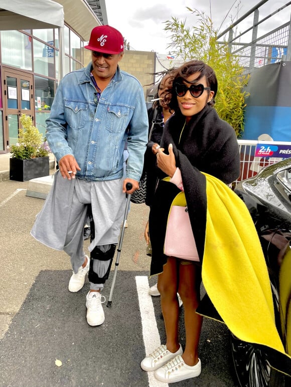 Yannick Noah et sa compagne Malika, enceinte, lors des "24H du Mans", le 15 juin 2024. © Fabien Faure/Bestimage