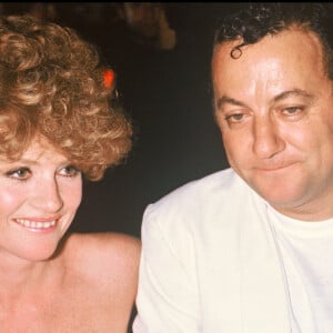 ARCHIVES - COLUCHE ET ISABELLE HUPPERT A L'AVANT PREMIERE DU FILM COUP DE FOUDRE 