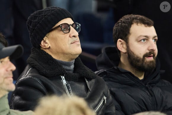 Rim'K et Roman Frayssinet - Célébrités assistent au match de Ligue des champions entre le PSG et l'Atlético de Madrid au Parc des Princes à Paris le 6 novembre 2024. © Cyril Moreau/Bestimage