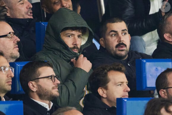 Redouane Bougheraba, Artus - Célébrités assistent au match de Ligue des champions entre le PSG et l'Atlético de Madrid au Parc des Princes à Paris le 6 novembre 2024. © Cyril Moreau/Bestimage