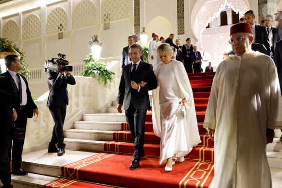 France's President Emmanuel Macron (C-L) and his wife Brigitte Macron (C-R) arrive at the Royal Palace for a state dinner in Rabat on October 29, 2024, as part of a three-day state visit by France's President to Morocco. © Ludovic Marin/Pool/Bestimage