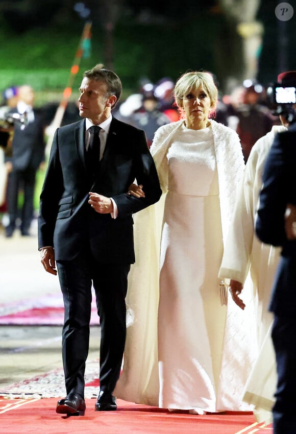 "Je veux leur dire à quel point le président et moi sommes solidaires avec elles et on essayera le plus possible. Il faut qu'on soit là et qu'on soit vigilants."
Emmanuel et Brigitte Macron - Dîner d'Etat offert par sa Majesté le roi Mohammed VI du Maroc en l'honneur du Président de la République Emmanuel Macron et de la première dame Brigitte Macron au Palais Royal de Rabat au Maroc le 29 Octobre 2024. © Dominique Jacovides/Bestimage 