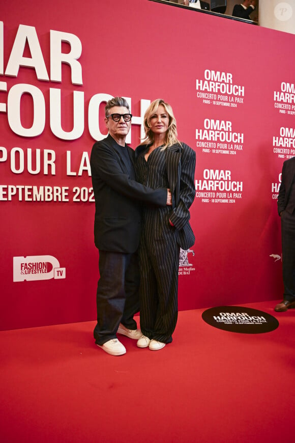 Marc Lavoine et sa compagne Adriana Karembeu au photocall du "concerto pour la paix" de Omar Harfouch au Théâtre des Champs-Elysées à Paris le 18 septembre 2024. © Perusseau / Tribeca / Bestimage 