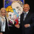 Du 17 au 20 décembre 2010, l'artiste brésilien résidant à Miami Romero Britto présente d'étonnants portraits au Carrousel du Louvre. Buzz Aldrin et sa femme Lois devant leur portrait. 
