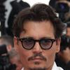 Johnny Depp monte les marches du 64e festival de Cannes. 14 mai 2011