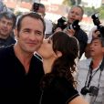 Jean Dujardin et Bérénice Bejo lors du photocall de The Artist, de  Michel Hazanavicius, présenté le 15 mai 2011, au festival de Cannes.