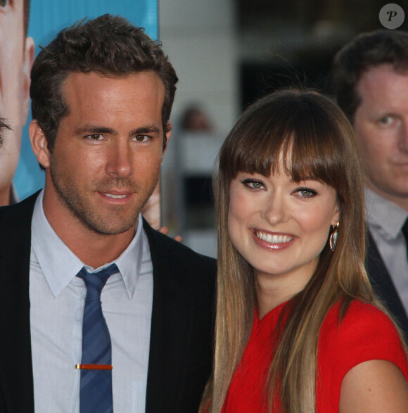 Olivia Wilde brille sur le tapis rouge de l'avant-première de Change Up aux côtés de son partenaire à l'écran, Ryan Reynolds, à Los Angeles, le 1e août 2011