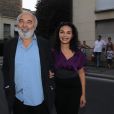 Gérard Jugnot et sa compagne Saïda Jawad arrivent à l'ambassade d'Italie à Paris où est célébré le lancement de la collection Signature de Tod's. Le 2 octobre 2011