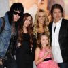 Trace Cyrus en famille pose lors d'une avant-première en mars 2010 à Los Angeles