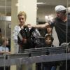Jason Trawick, Britney Spears et ses enfants à l'aéroport de Porto-Rico, le dimanche 11 décembre 2011.